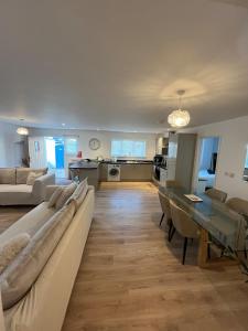 a living room with a couch and a table at An Treth in Bude