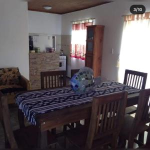 a dining room table with a table cloth on it at Cabañas Cosquín in Cosquín
