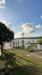 a beach with a cross on the side of the water at Lagoa do Bonfim RN in Natal