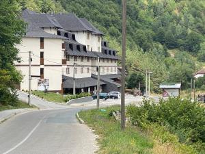 a large building on the side of a road at Bela Reka 204 in Brzeće