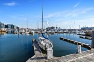 a boat is docked at a dock in a harbor at Willow Estates Harborplace in Baltimore