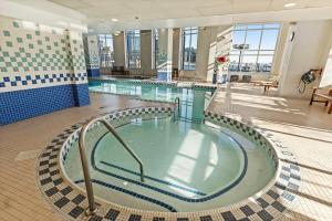 a large swimming pool in a large building at Willow Estates Harborplace in Baltimore