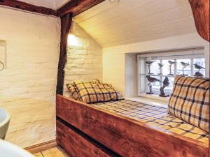 a room with a window seat in a room with a window at 4 person holiday home in Asaa in Aså +19 photos