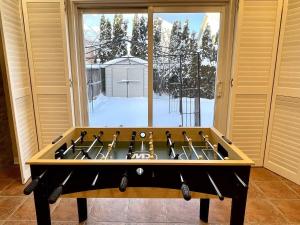 a room with a table with a large window at Paris Charm Modern 4B3B, Kitchen, Parking,5G in Richmond Hill