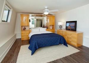 a bedroom with a bed and a ceiling fan at Bodega Bay Magical Ocean Front w/Amazing View! in Bodega Bay +97 photos