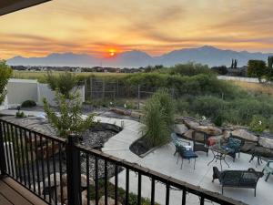 a view of a patio with a sunset in the background at Scenic Farmhouse in Riverton