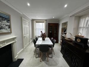 a dining room with a table and chairs at Merchiston Residence in Edinburgh