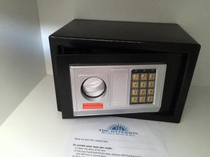 a small microwave oven sitting on top of a table at The Hyperion Boutique Hotel in Florianópolis