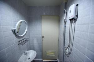 a bathroom with a shower and a sink and a mirror at Kitty Guesthouse in Phi Phi Islands +43 photos