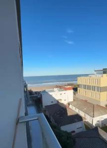 a view of the ocean from a building at CoSTA Y MAR II in Villa Gesell