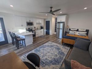 a living room with a bed and a kitchen at Scenic Farmhouse in Riverton