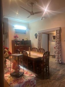 a dining room with a table and chairs at Smriti- loving memories in Jaipur