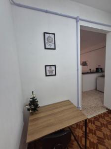 a room with a table and a clock on the wall at Studio em Piedade in Rio de Janeiro +25 photos