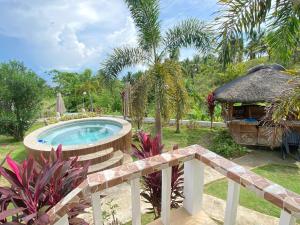 a swimming pool in a yard with a fence at Kalipay Bungalows Alcoy in Alcoy