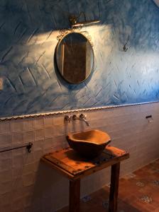 a bathroom with a sink and a mirror on the wall at Casa Rural El Pajar de Puchero in Ruidera +93 photos