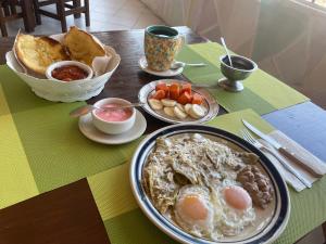 a table with a plate of food on a table at Hotel Los Arcos in Tlalpujahua de Rayón +6 photos