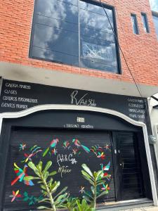 a store front with a chalkboard with colorfulbons on it at C apartment in Ajijic