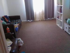 a living room with a couch and a window at Dream Catcher Air B&B in Berri