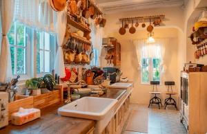 a kitchen with two sinks and a large window at Home Tower tree เชียงใหม่ in Pong Yaeng +127 photos