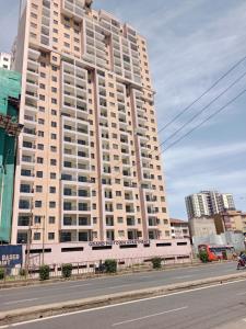 a large white building on the side of a street at Relax Crib Nairobi in Nairobi