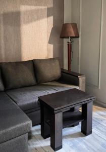 a living room with a couch and a coffee table at Valley Park Dilijan in Dilijan