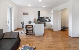 a living room with a couch and a kitchen at Ferienhof Broger FeWo Obstbäumle mit Pool in Neukirch +58 photos