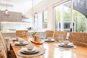 a kitchen and dining room with a table and chairs at Ocean Grove Beach House 2 - Pets - Late checkout - Accessible in Ocean Grove