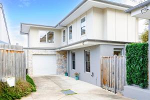 a white house with a gate and a fence at Ocean Grove Beach House 2 - Pets - Late checkout - Accessible in Ocean Grove