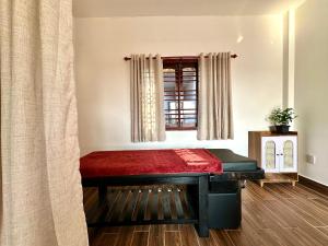 a bed in a room with a window at Ovana Homestay in Phan Thiet +14 photos
