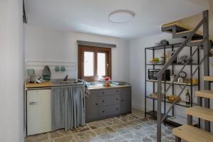 a kitchen with a sink and a counter at Plaza Suites in Piazza Armerina