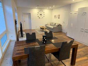 a dining room and living room with a table and chairs at Centrally located in Coesfeld in Coesfeld