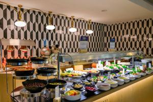 a buffet line with a lot of food on display at DoubleTree by Hilton Jeddah - Alandalus Mall in Jeddah