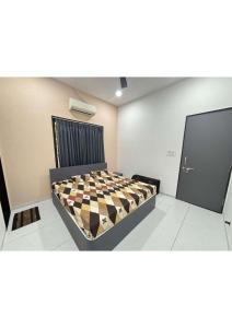 a bedroom with a checkered bed in a room at Grey Stone Farm House in Surat +15 photos