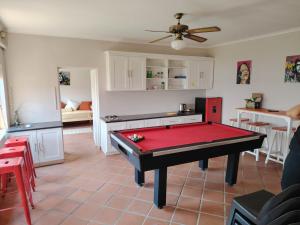 a living room with a ping pong table in it at Wakanda on Hartbeespoort Dam in Hartbeespoort
