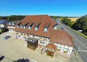 an overhead view of a building with orange roofs at Hotel & Restaurant Ernst in Giesen