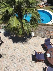an overhead view of a patio with chairs and a pool at Pool- AirCon- Quiet&Peaceful- FamilyFriendly in Manilva