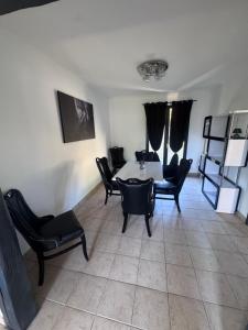 a dining room with a table and chairs at Loveroom Montargis in Montargis