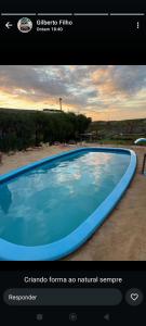 a screenshot of a picture of a swimming pool at Pedral Beach chalé e restaurante in Parnaíba