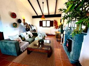 a living room with a couch and a table at MiLuna Oasis Suites in Huércal-Overa