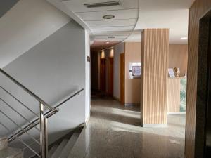 a hallway of a building with stairs and a stair case at Blu Hotel Pamplona in Imárcoain +26 photos