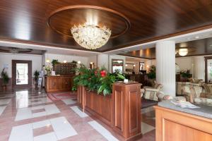a lobby of a hotel with a chandelier at Hotel Miramonti in Bagno di Romagna +50 photos