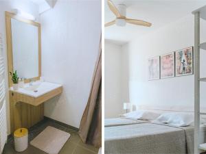 a bathroom with a sink and a bed and a mirror at Maison de vacances près du Mont Ventoux in Aubignan +25 photos