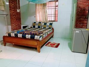a bedroom with a bed in a room at Hai Anh Guesthouse in Phú Quốc