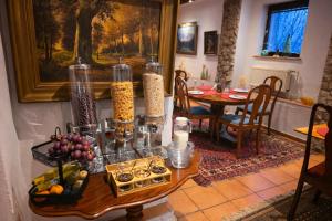 a kitchen with a table with food on it at Dworek Adamski in Wałbrzych