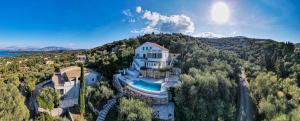 an aerial view of a house with a swimming pool at Eagle's Rest Villa in Kassiopi