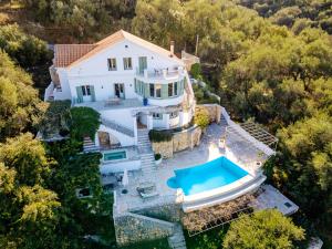 an aerial view of a house with a swimming pool at Eagle's Rest Villa in Kassiopi