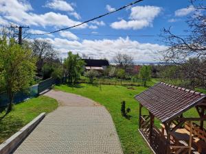 a walkway in a field with a building in the background at Vadrózsa Nyaraló in Balatongyörök