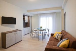 a living room with a couch and a table at Residence Elisabetta in Cesenatico
