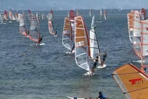 a group of people windsurfing in the water at JuliaHome in Marina Julia