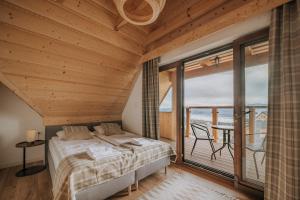 a bedroom with a bed and a large window at Osada Widokówka- Przystanek Podhale in Czorsztyn +68 photos